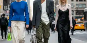 From Runway to Sidewalk: 5 High-Fashion Elements Integrated into 2026 Street Style Stylish people blending high fashion and street style on an urban sidewalk in 2026, showcasing oversized blazers, deconstructed dresses, and sculptural tops.