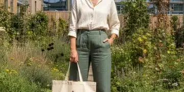 Woman in sustainable outfit, urban garden, eco-friendly fashion